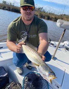 Spotted weakfish caught by two people in Manns Harbor