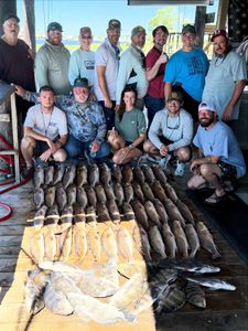 13 people enjoying a fishing trip in LA