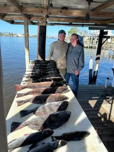 Two people fishing in Lafitte