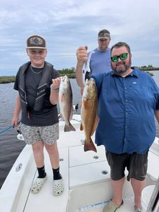 Redfish duo caught in LA with fishing gear