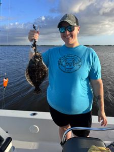 Fisherman catching a Southern Flounder in LA