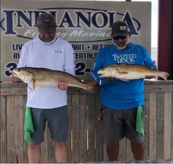 Two people fishing in Port Lavaca