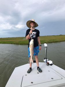 Angler holding a large redfish in Port Lavaca
