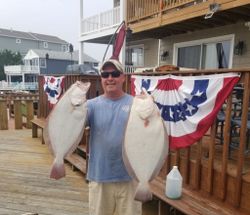 An angler with a couple of big fish in Atlantic City