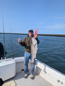 Reeling in a big striped bass off the Atlantic City coast!