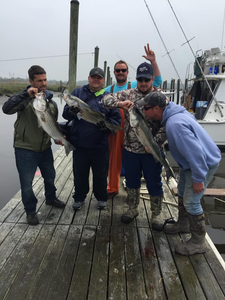 Anglers posing with their 3 big fish catch in NJ