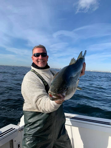 Lone fisherman catching fish in Neptune's waters