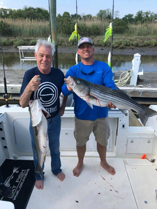Two striped bass caught while fishing in Neptune