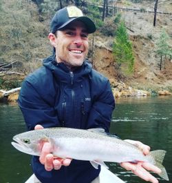 A single rainbow trout fishing in CA