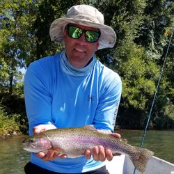 Angler with a rainbow trout caught in Redding
