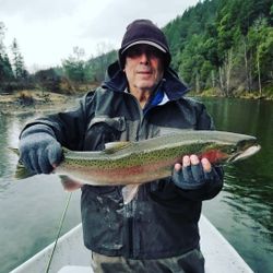 Angler with a large rainbow trout caught while fishing in Redding