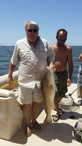 Two people fishing on a cruises, fishing, tours trip in FL