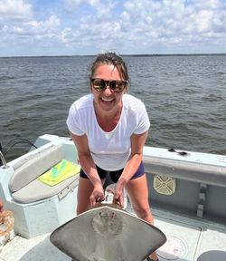 A person fishing in Gulf Breeze