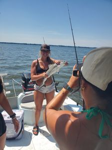 Two people enjoying a fishing cruise in Gulf Breeze