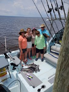 A group of 5 people enjoying a cruises, fishing, and tours experience in FL
