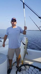 A person enjoying a fishing cruise in Gulf Breeze