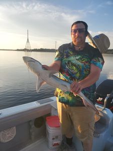 A person enjoying a fishing cruise in Gulf Breeze