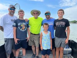 Group of 6 people fishing in Port Clinton