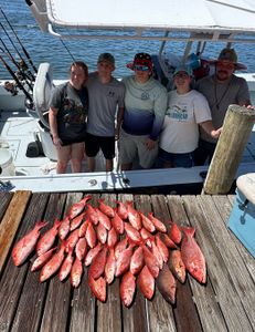 A group of 5 people fishing in Pensacola