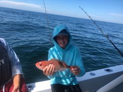Fisherman with one 15-inch fish in FL