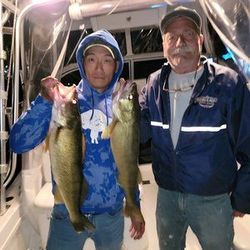 Two anglers fishing in NY with 2 big fish