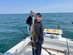 Angler fishing in Buffalo, New York with a 21-inch catch
