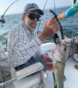 A person fishing in Buffalo, with the best catch of the day
