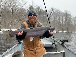 Angler holding a rainbow trout caught in Pulaski