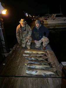 Two anglers with fishing rods in NY