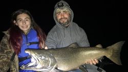Angler holding a large rainbow trout caught in Pulaski