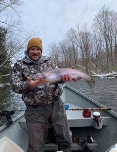Photograph of a rainbow trout, 22 inches long, caught while fishing in Pulaski