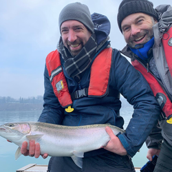 Two people fishing on the water in Ontario