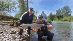Angler with a beautiful rainbow trout catch in OR