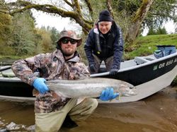 Two anglers enjoying a fishing trip in OR