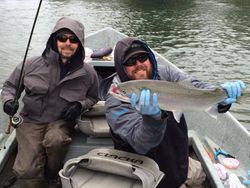 Angler holding a large rainbow trout in Aumsville