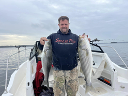 Two striped bass caught while fishing in Cumming