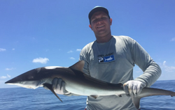 Angler catching a 28-inch Atlantic Sharpnose Shark in Panama City
