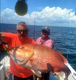 Two anglers enjoying a fishing trip in Panama City