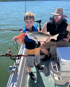 Anglers casting fishing rods in Mannford