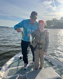 Two people fishing in a beautiful location in OK