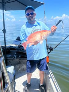 Person fishing in Mannford, Oklahoma