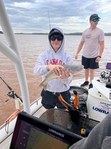 Fishing trip on lake in Mannford OK with boat and fishing equipment