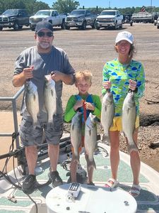 Striped bass fishing catch displayed on boat dock in Mannford OK