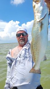 Angler holding a 27-inch fish in Matagorda