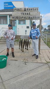 Two people fishing in Port Aransas