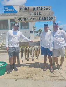 Two people enjoying a fishing trip in Port Aransas