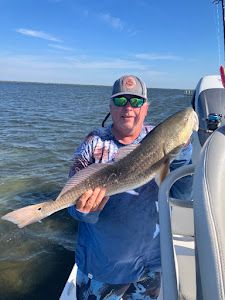 Lone fisherman with a rod and reel in TX