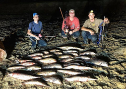 Three people fishing in TX