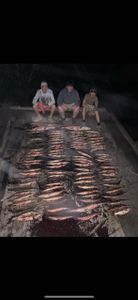 Three people fishing in TX