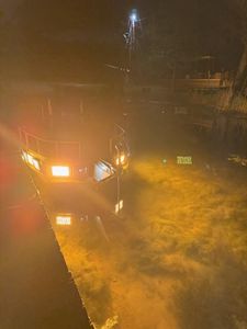 Fishing boat with lights illuminated at night in Orange TX waters